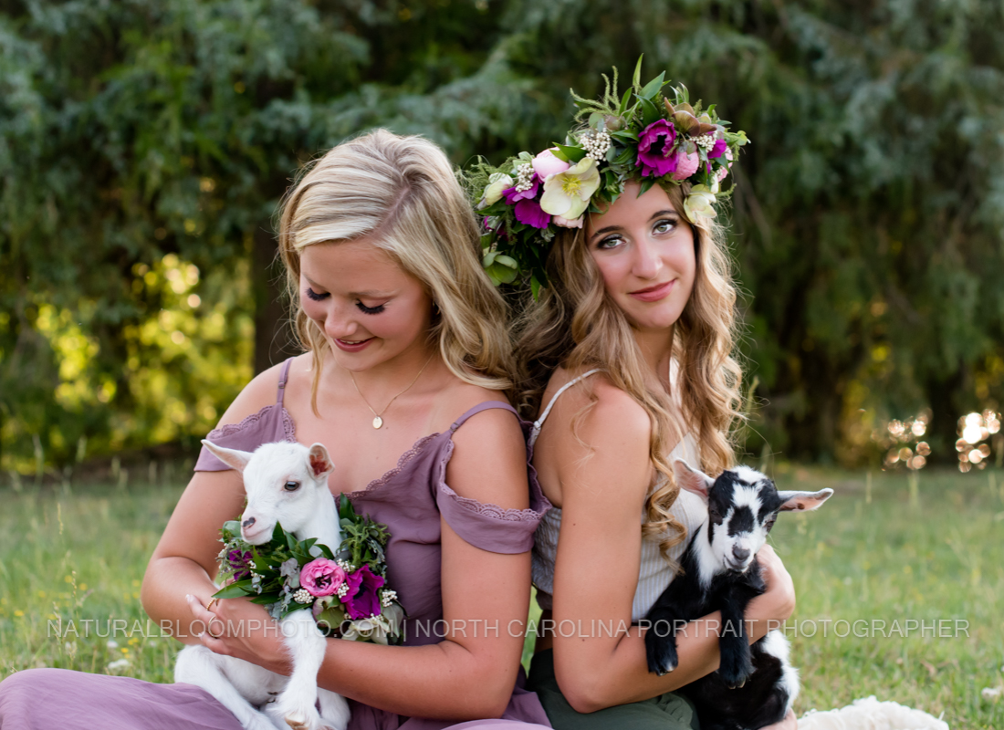 Senior girls model with floral crowns and baby goats for styled photoshoot