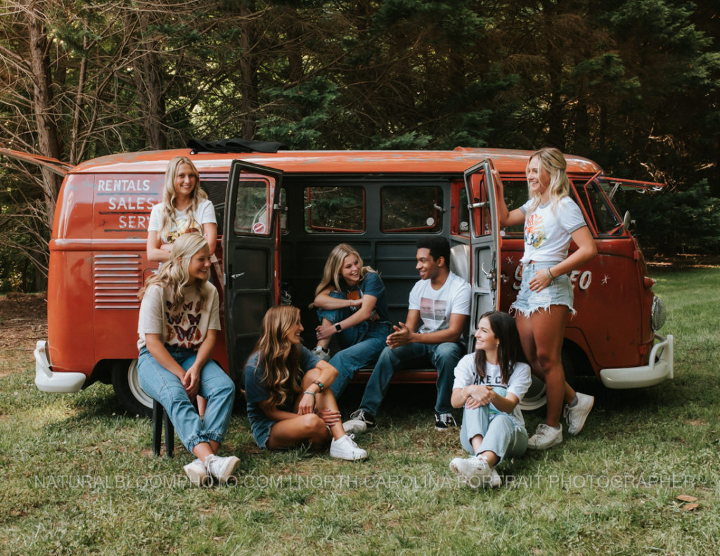 High School Senior Model Rep Team large group poses with vintage vw bus